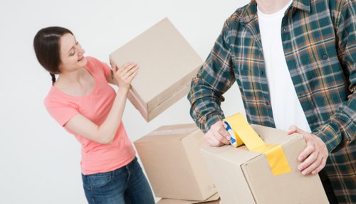 Removal team planning a house move in Brentford with boxes and furniture