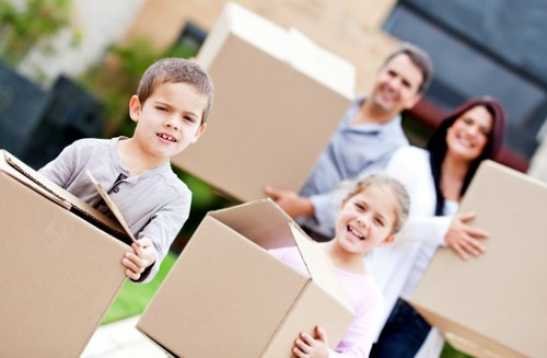 Customer handling packed boxes safely near storage units