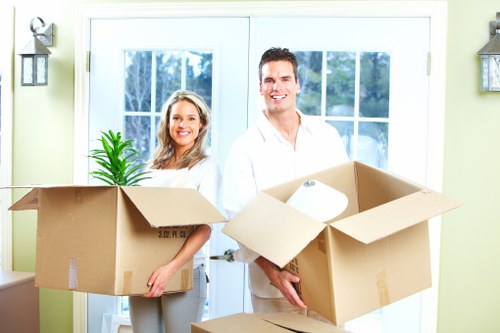 Brentford flat removals setup with boxes, tape, and protective covers